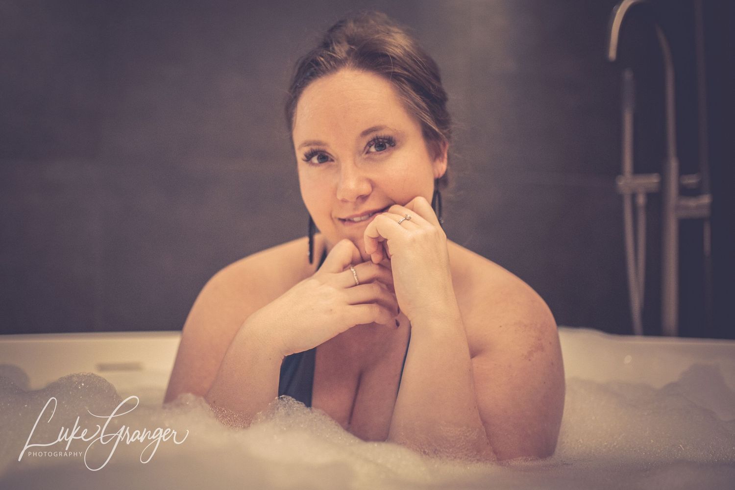 boudoir photo close up of woman in a bubble bath