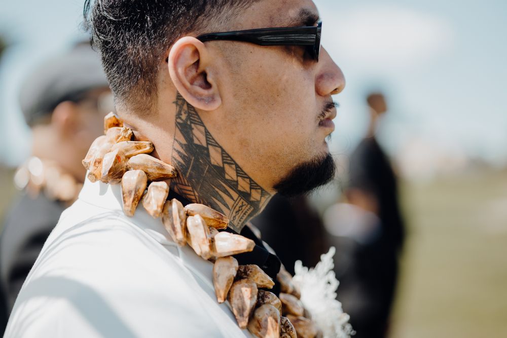 Close up of traditional Hawaiian lei worn at a wedding ceremony.
