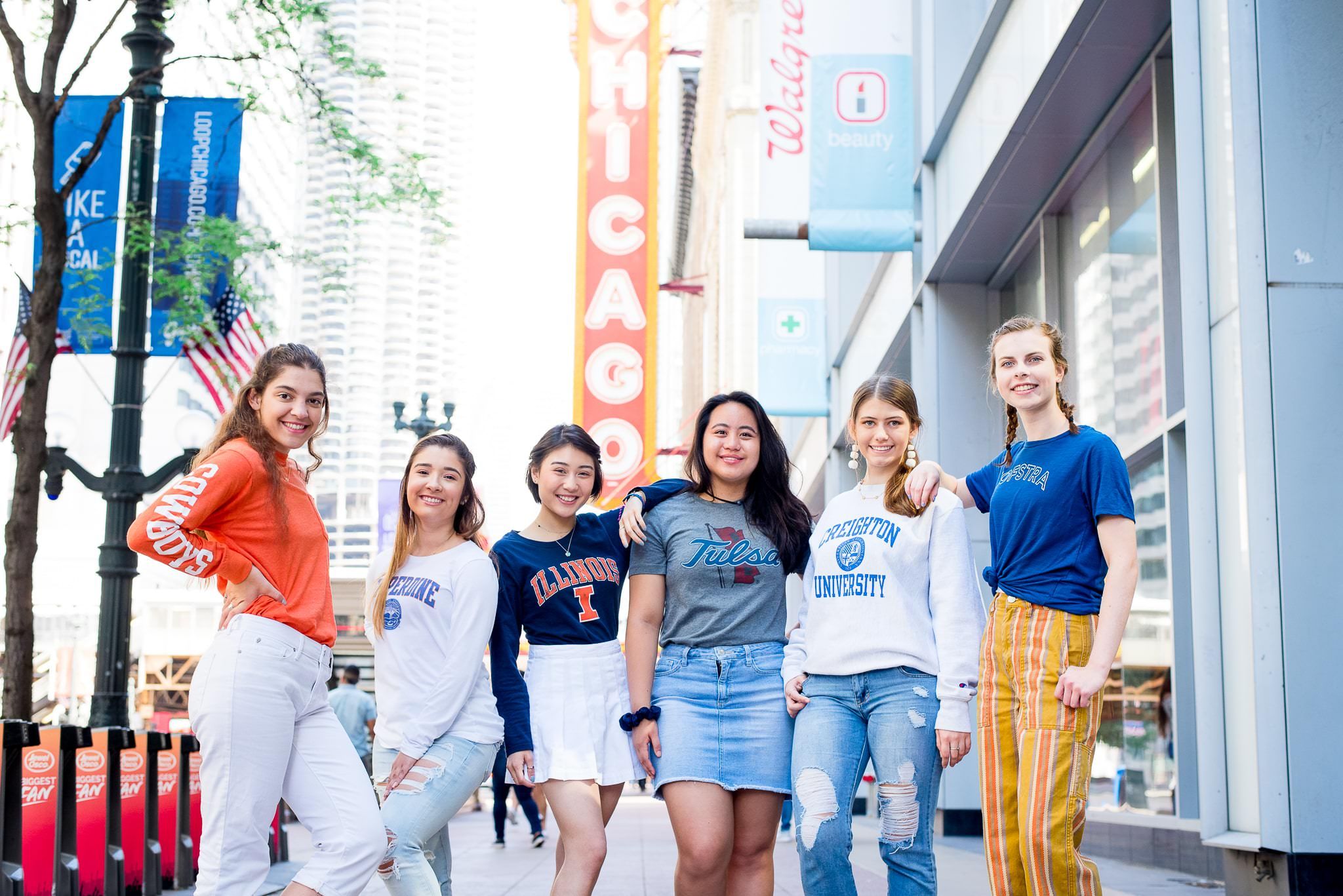 six senior girls in front of the Chicago Theater sign for Chicago senior pictures