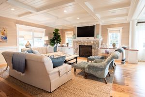 Real Estate Photograph of a living room picture with fireplace and television