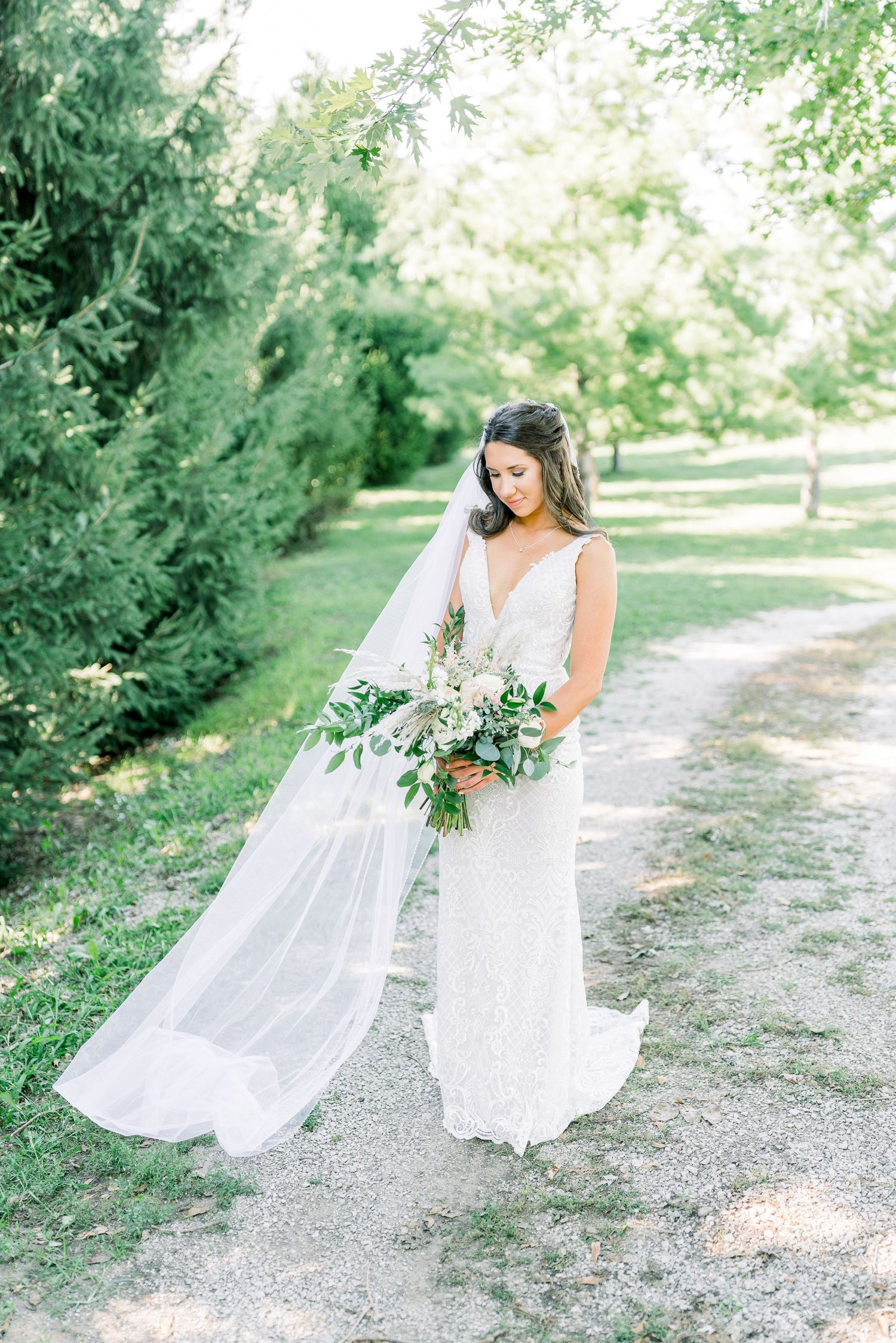 Veil wedding photos at Prairie Moon Winery in Ames, Iowa with White Willow boho florals