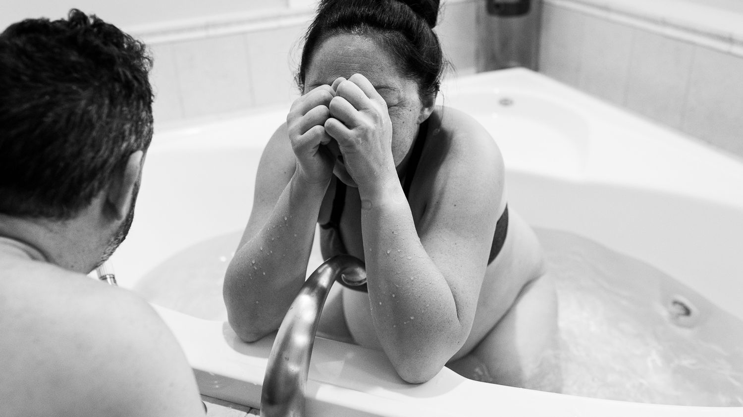 A moment of solitude between partners during their Longmont, CO home birth