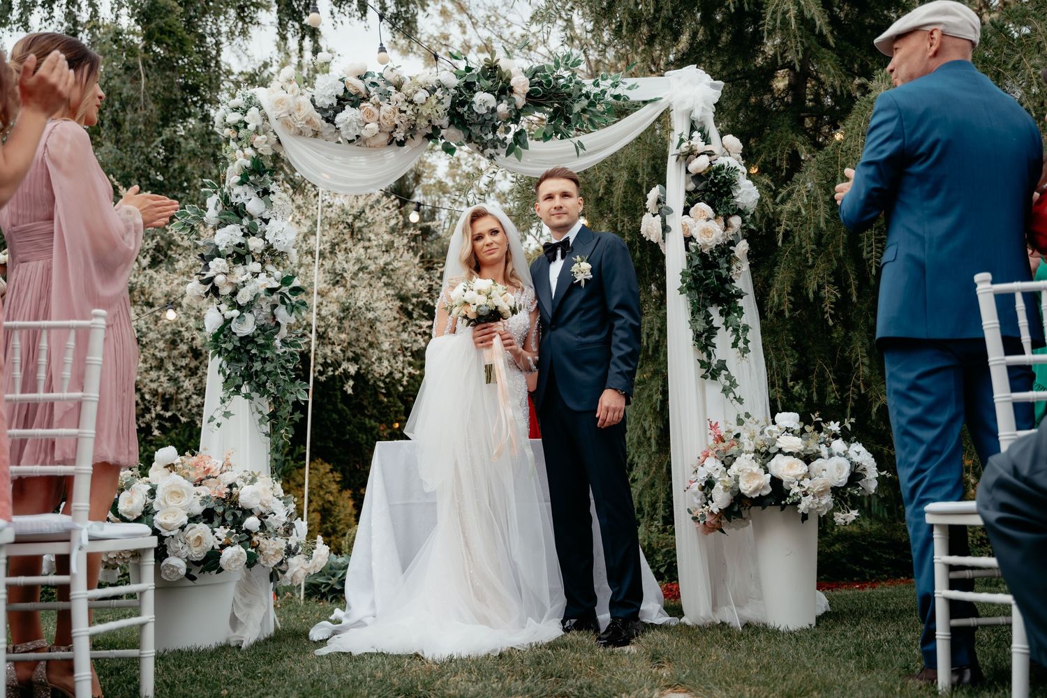 Wedding day with a lot of guests and very in love groom and bride