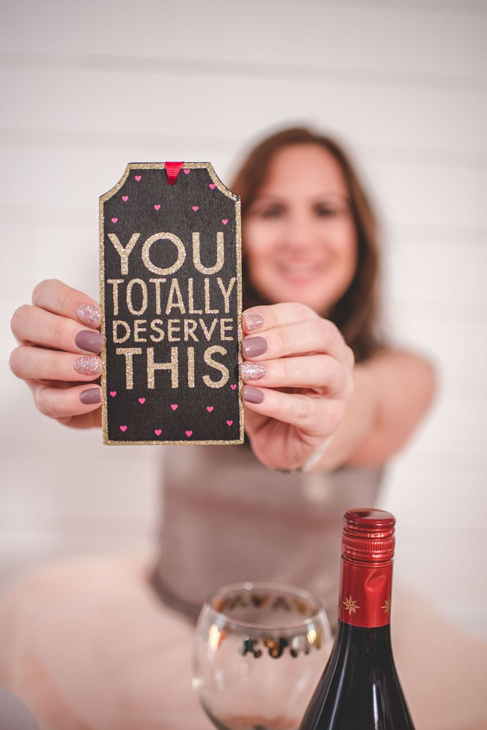 Adult Cake Smash Photo of a woman holding an inspirational plaque