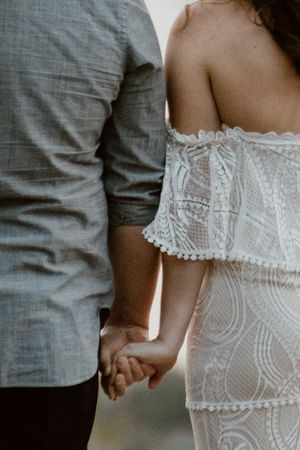 Bohemian-bride-and-groom-holding-hands