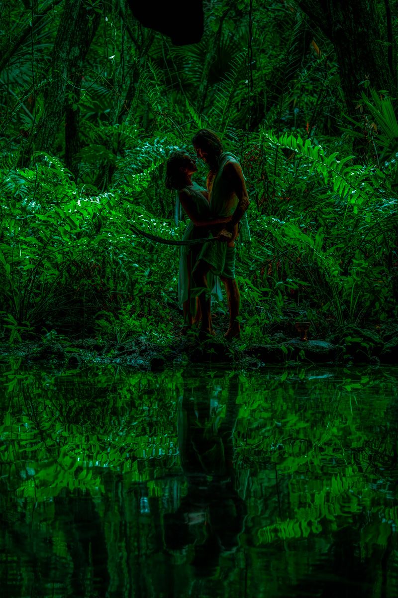 persian royalty lovers meeting in secret in the jungles of tulum in a cenote