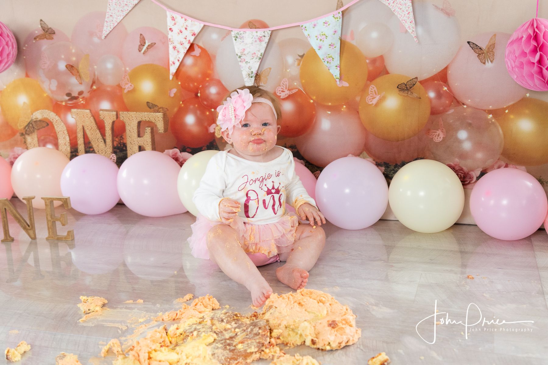 celebrating 1st birthday with a cake smash