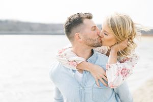 Light and airy film lakeside dock engagement session at Gray's Lake in Des Moines, Iowa