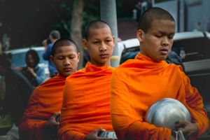 Environmental portrait of monks collecting alms in Chiang Mai Thailand