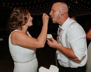 bride feeding groom cake