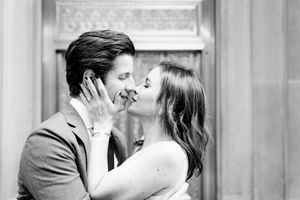 man and woman hug and get close to kissing for downtown Chicago engagement Picutres