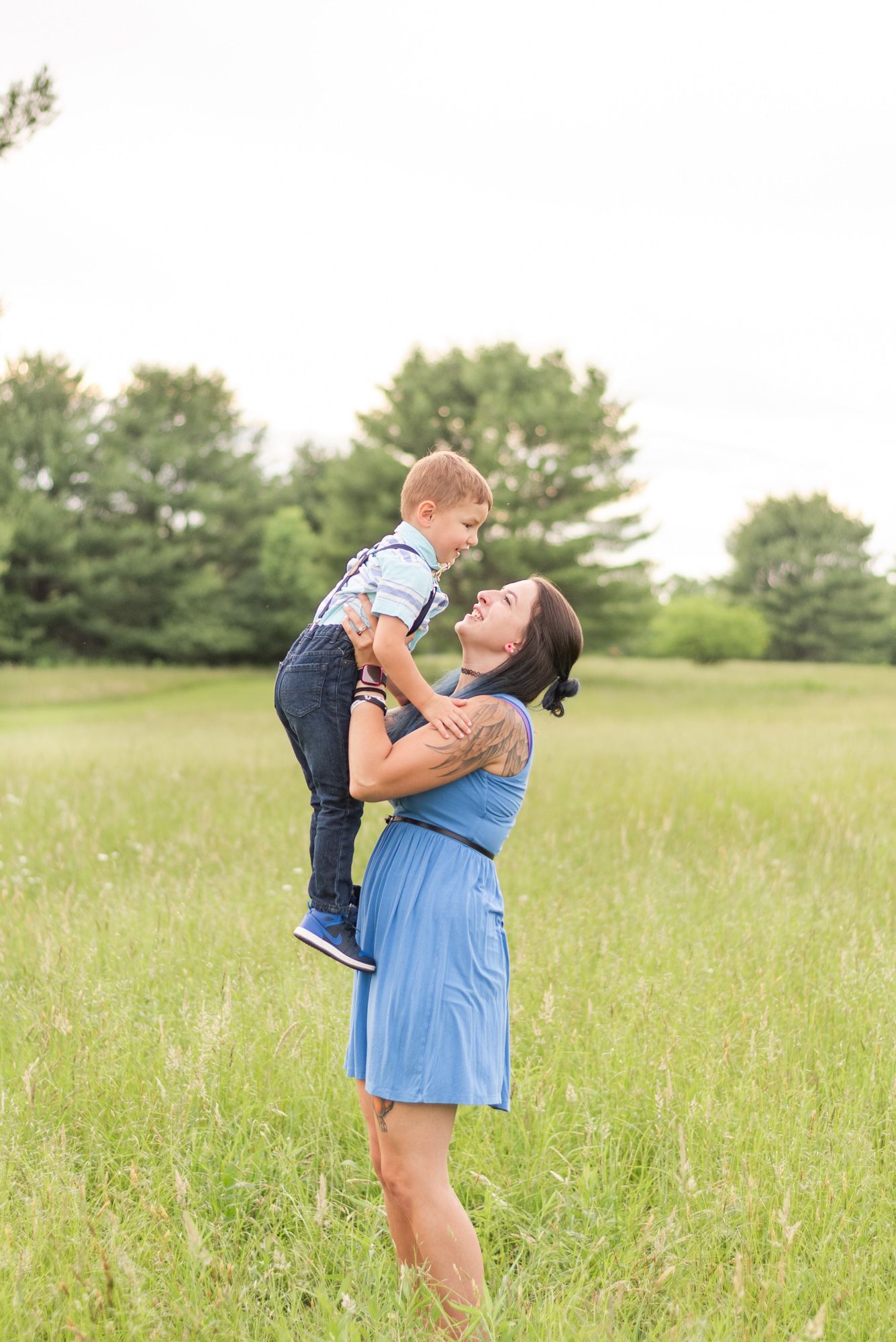 Mom holding son in field in Clarion Pennsylvania