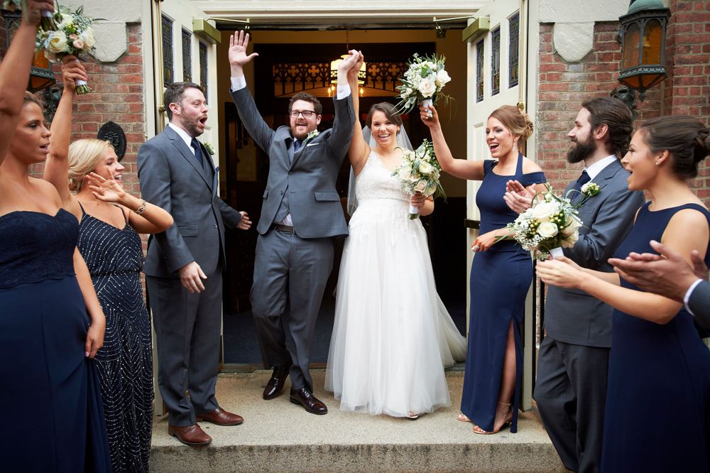 wedding photo of bride and groom leaving a church in Philadelphia