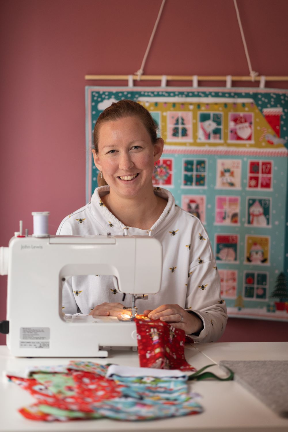 Candid headshot of small business owner, Ruth, in her home studio in New Barnet.