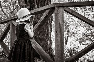 Girl in dress and hat at National Rhododendron Gardens by Melbourne family photographer Kate Cashin.