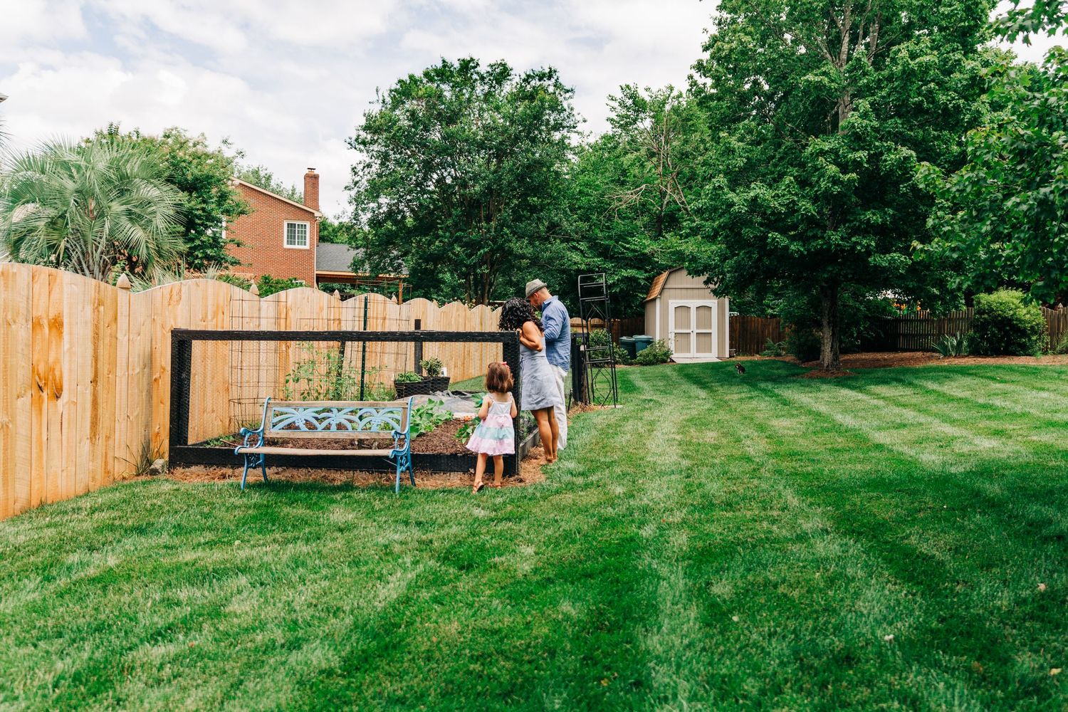 Family looking at their backyard garden in Charlotte, NC