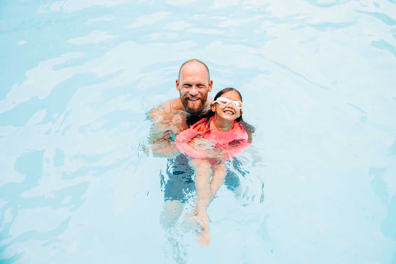 Dad and daughter in their Dilworth pool