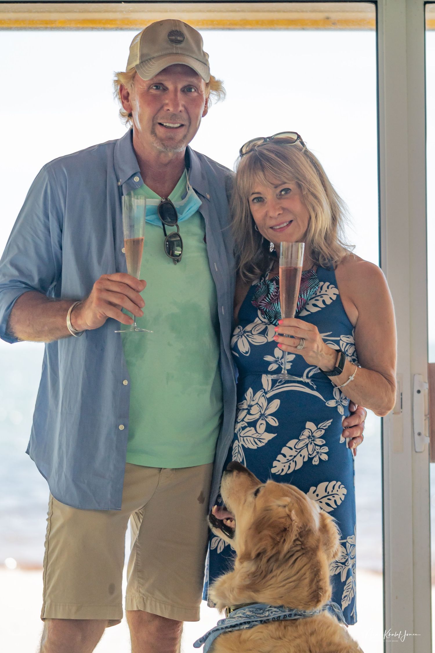 Casual beachside gathering with golden retriever in modern coastal interior.