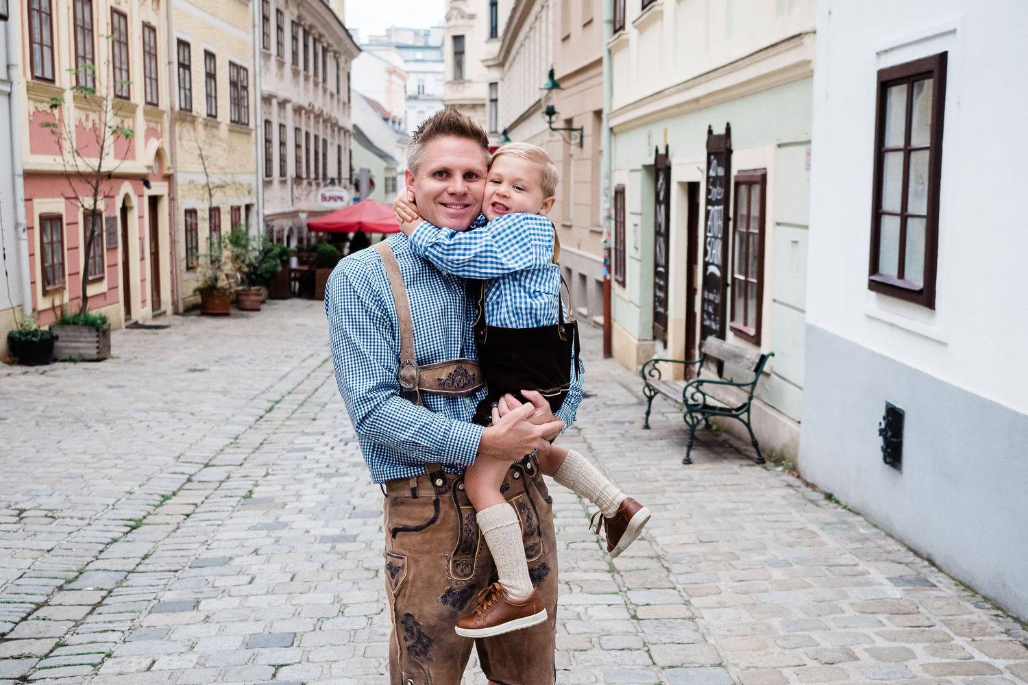 Father and son photograph wearing lederhosen in Vienna Austria