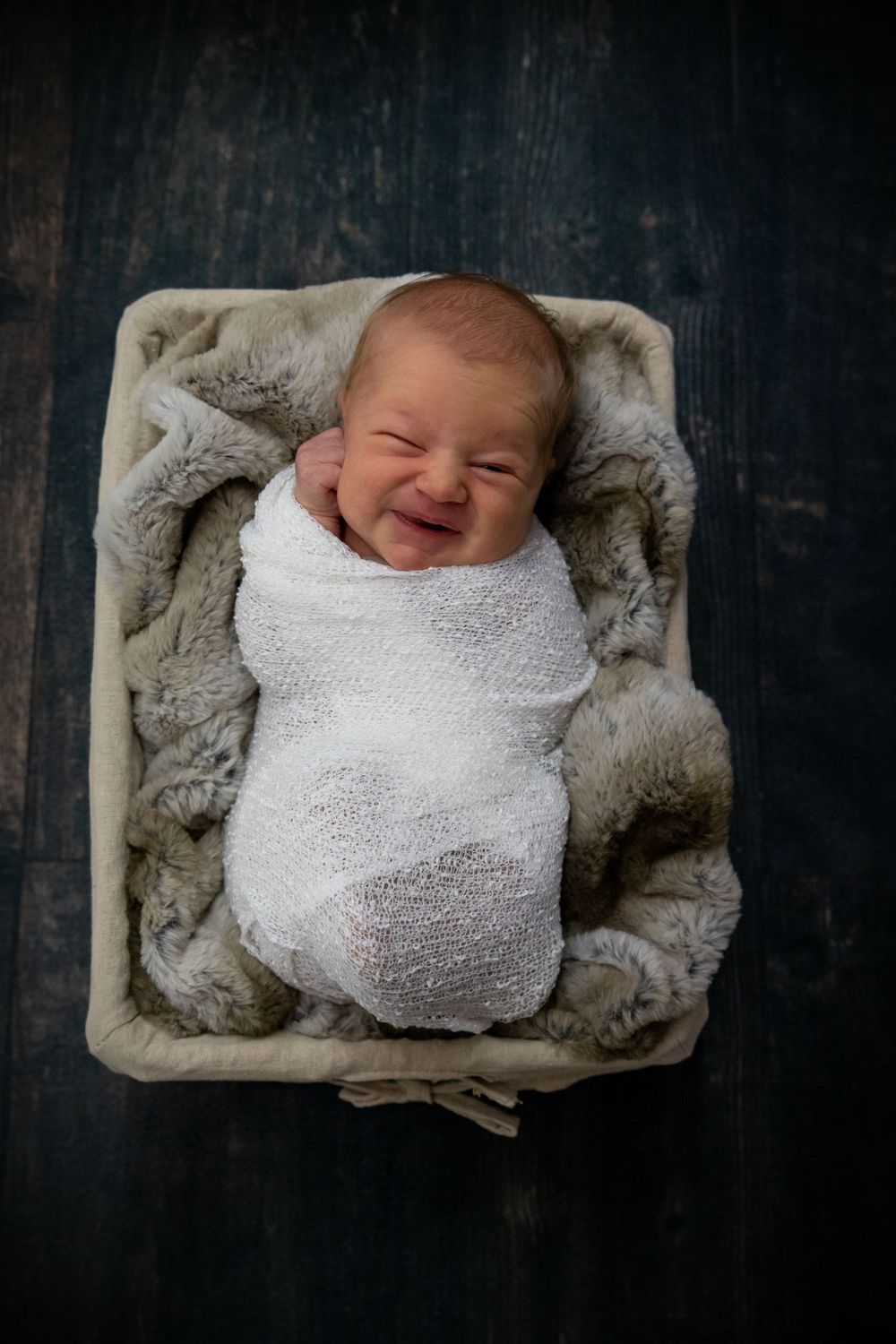 Newborn photography of swaddled baby