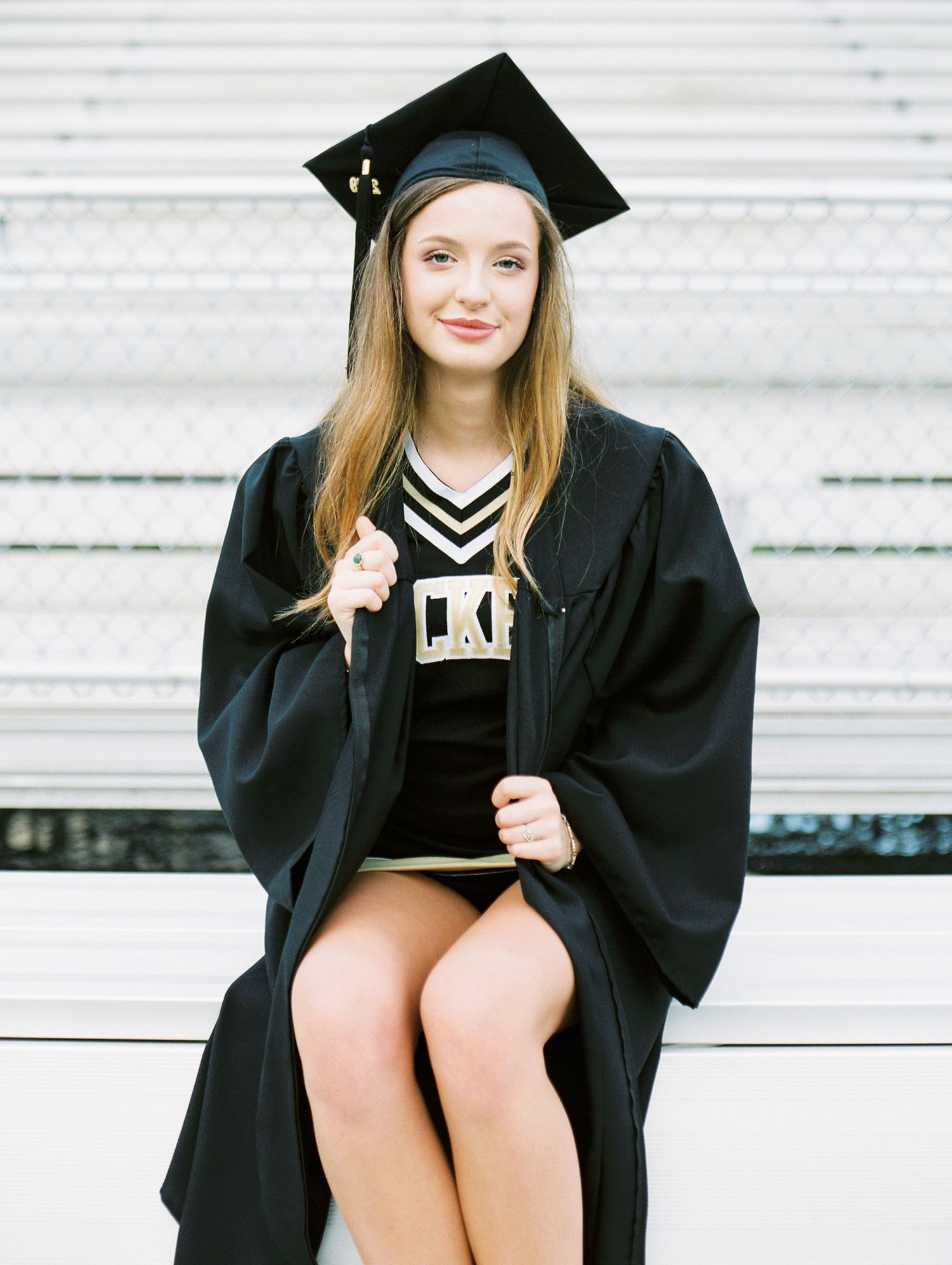 Louisiana senior portrait photography of Oak Forest Academy cheerleader in the football stadium