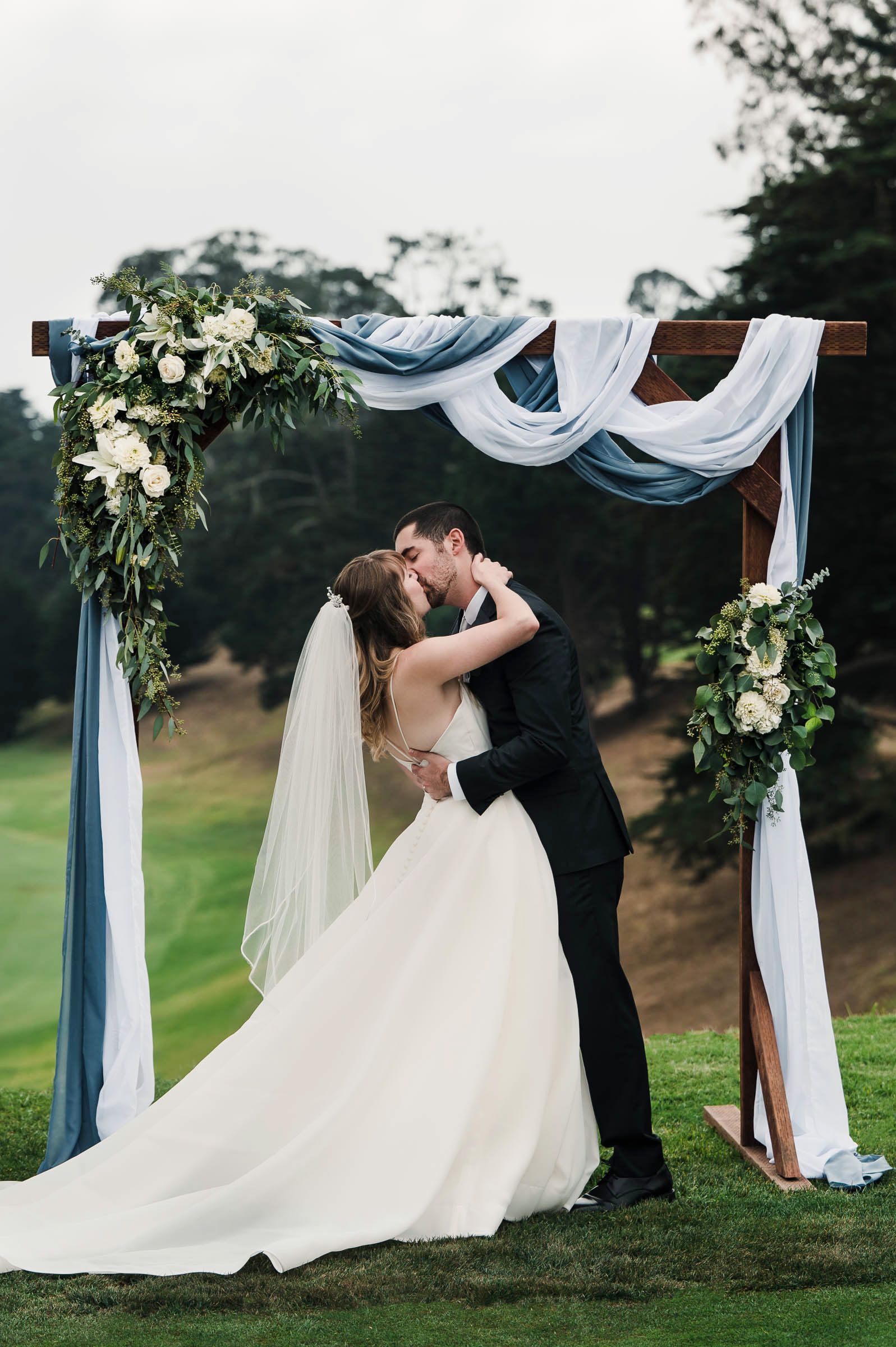 bride and grooms first kiss as mr. and mrs. Levy