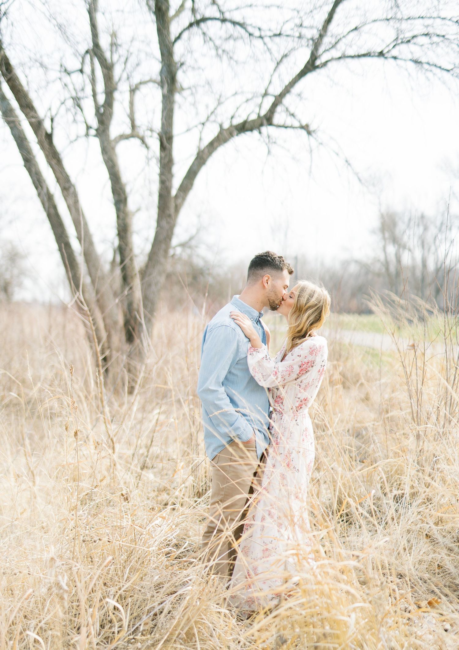 Light and airy film lakeside dock engagement session at Gray's Lake in Des Moines, Iowa