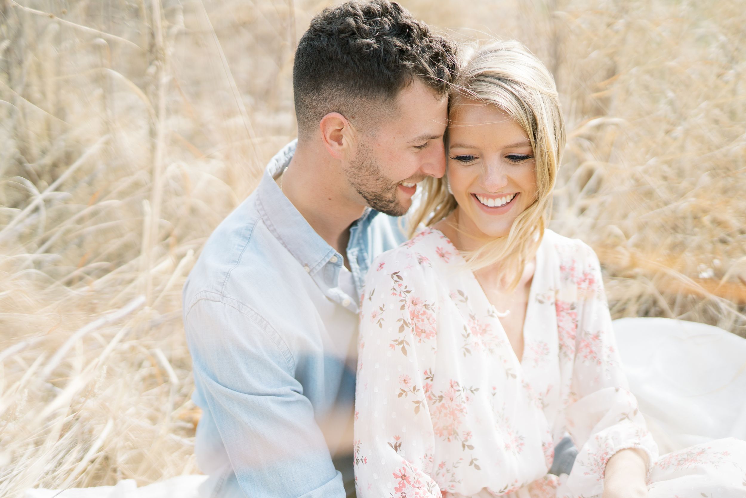Light and airy film lakeside dock engagement session at Gray's Lake in Des Moines, Iowa