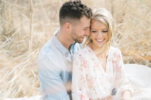 Light and airy film lakeside dock engagement session at Gray's Lake in Des Moines, Iowa