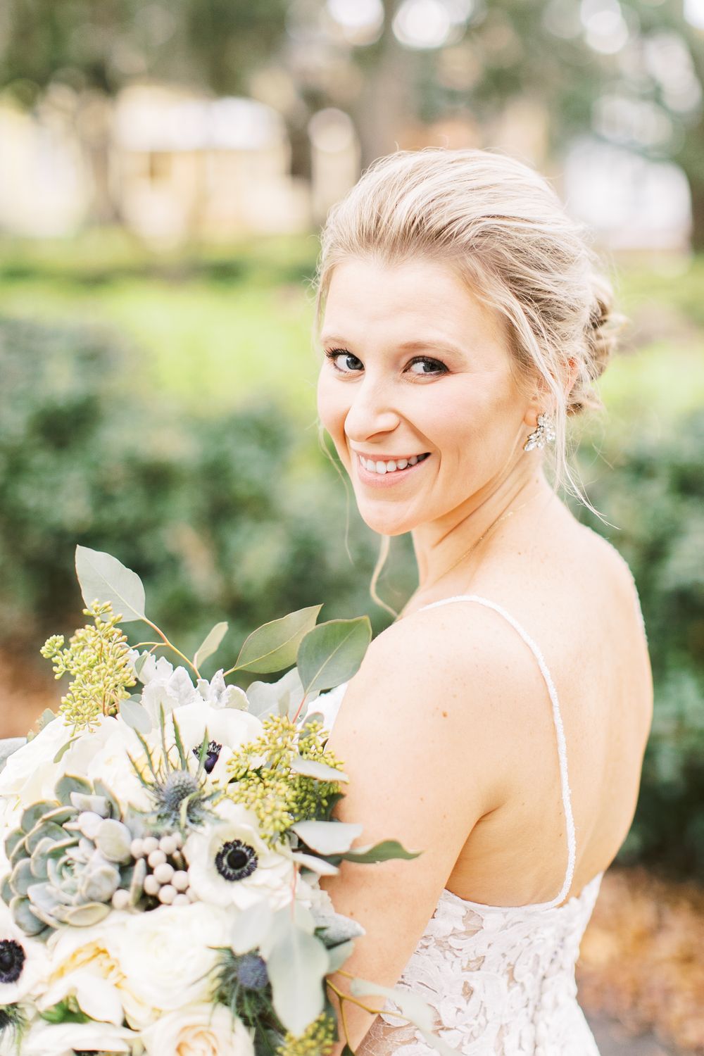 kayley taking bridal portraits on her wedding day in savannah, ga