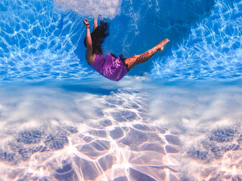 girl falling into pool