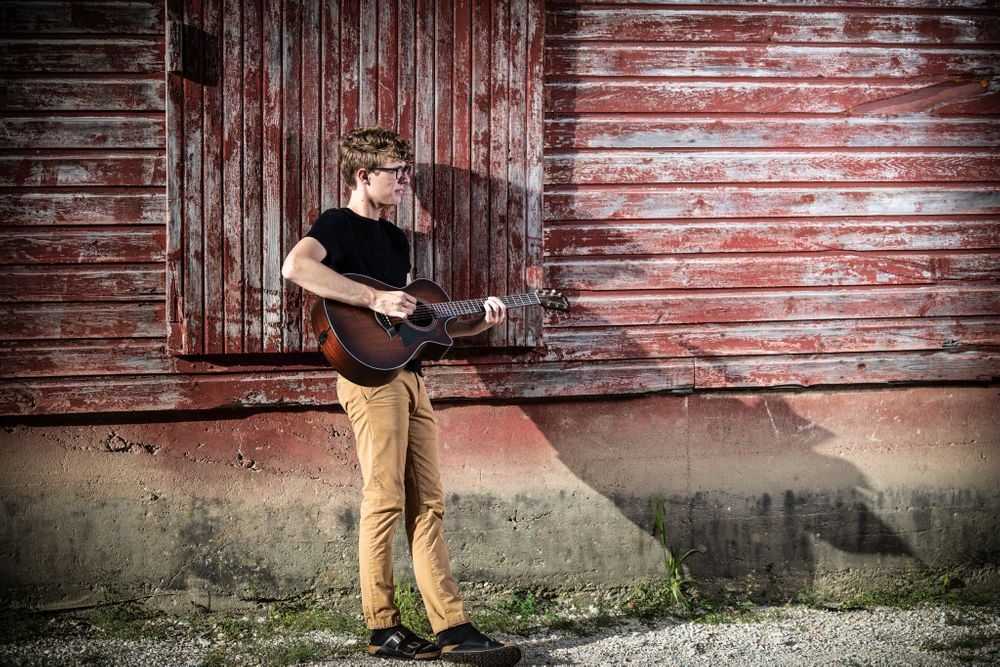 Guitar, barn, birkenstocks