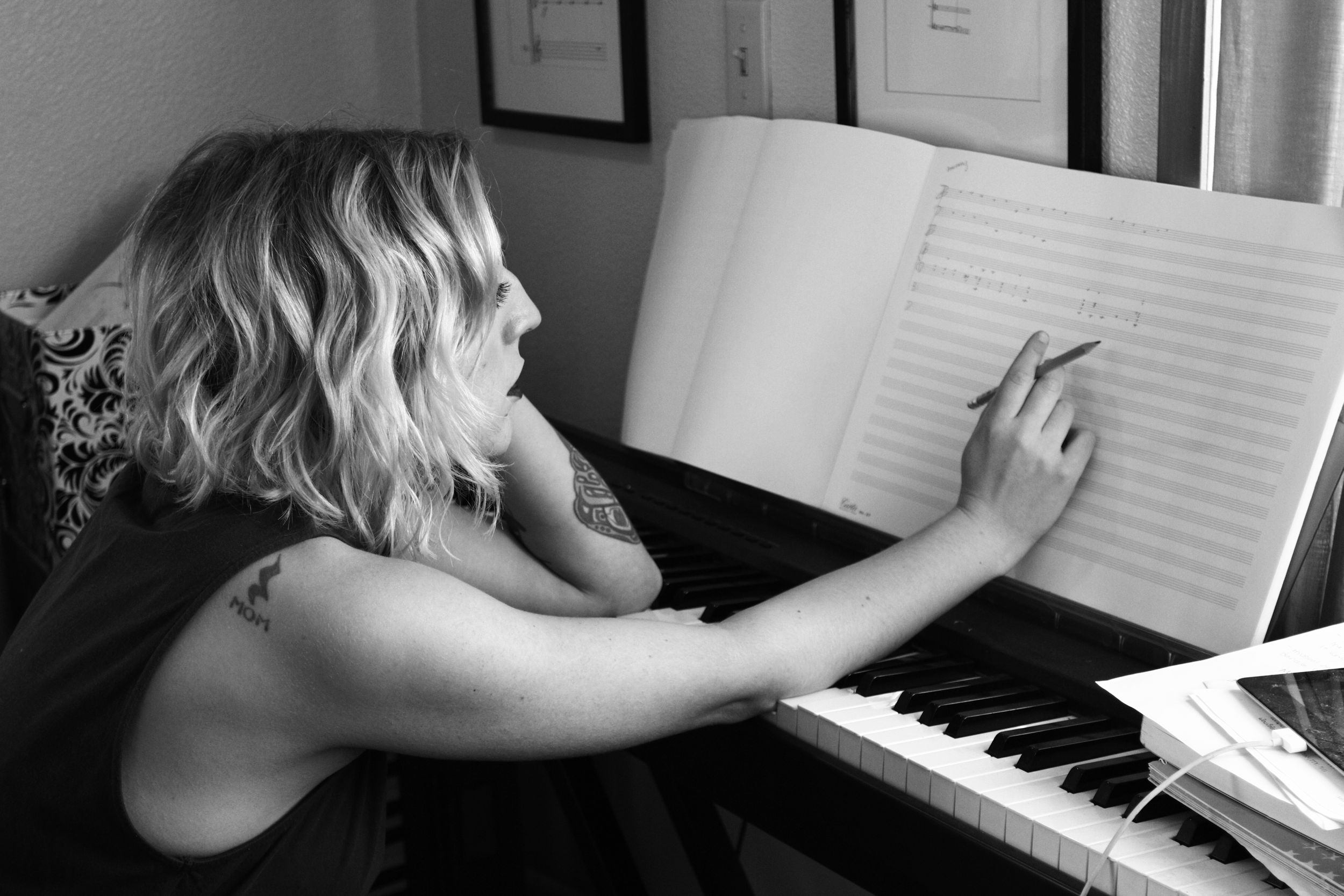 Composer Kaley Lane Eaton at her piano, working on a new project.
