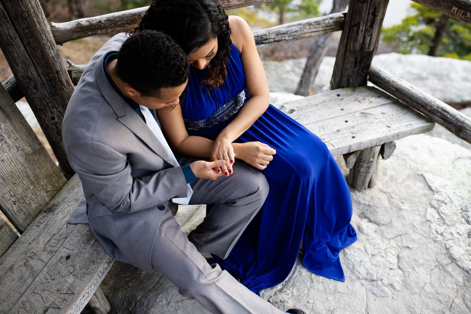 Couple looking at engagement ring at Minnewaska State Park