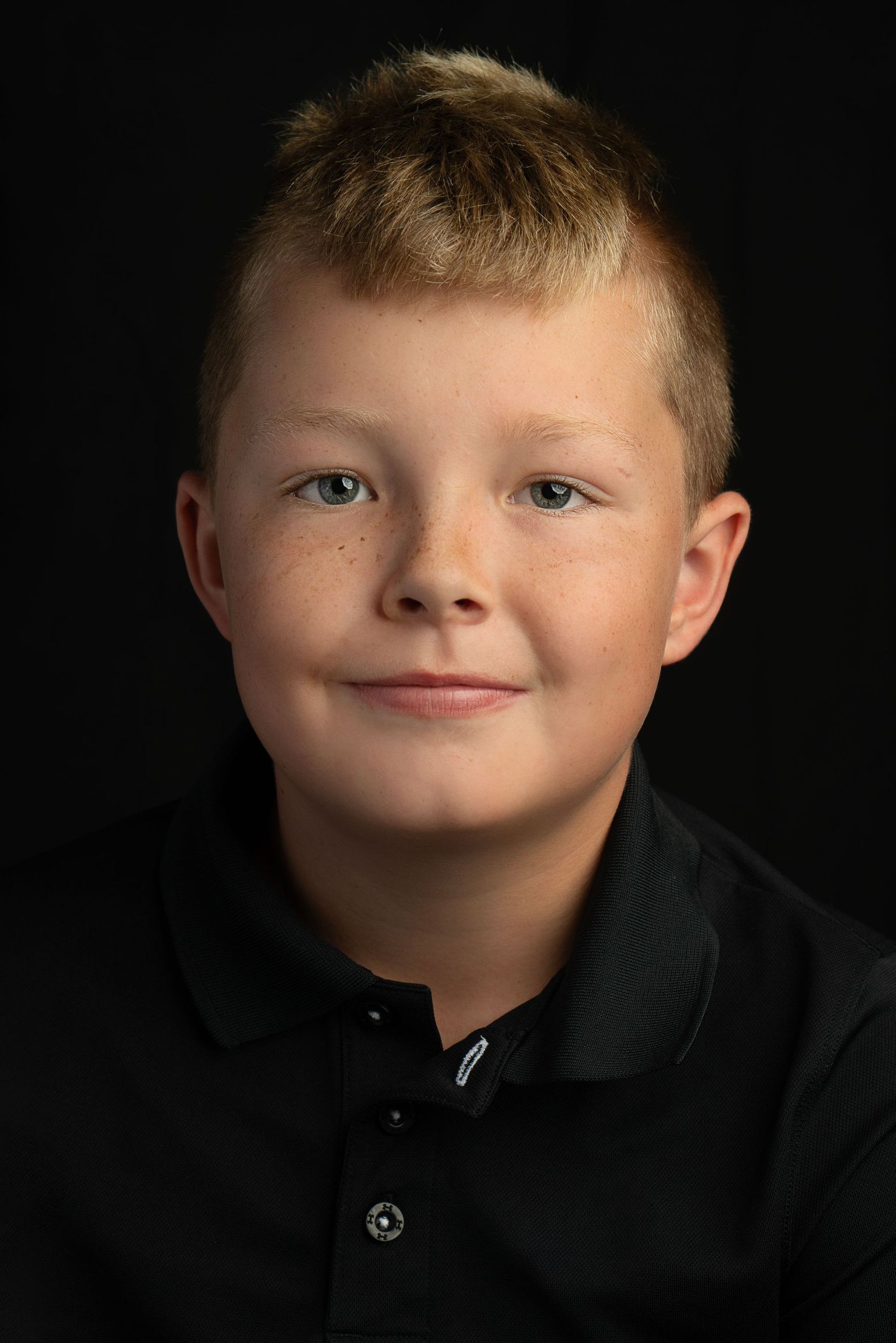 heirloom portrait of boy on black background