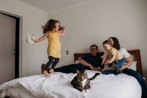 Family photos jumping on the bed