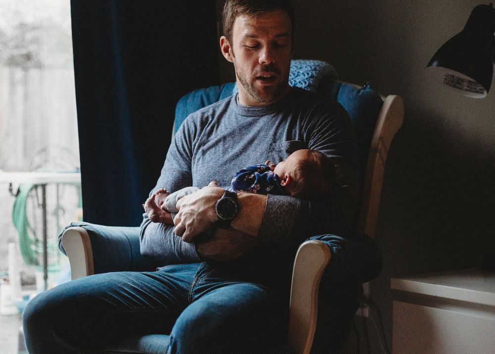 father newborn in chair