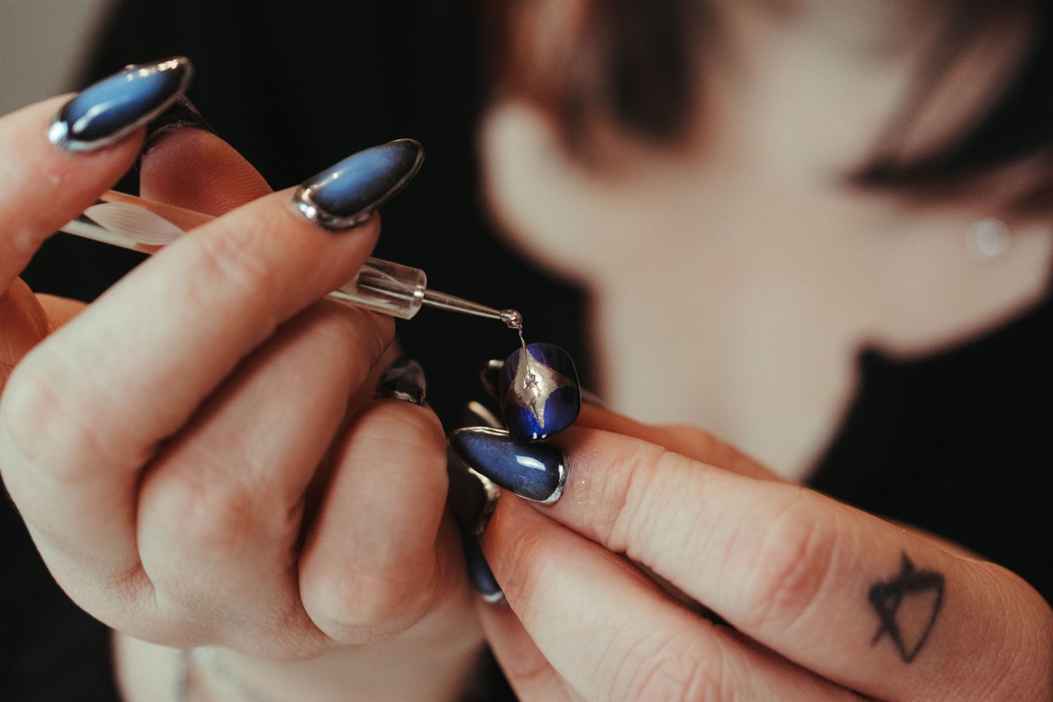 Kayla of KRAESTUDIO in ERIE PA working on set of custom nails for a client while I captured her in action.
