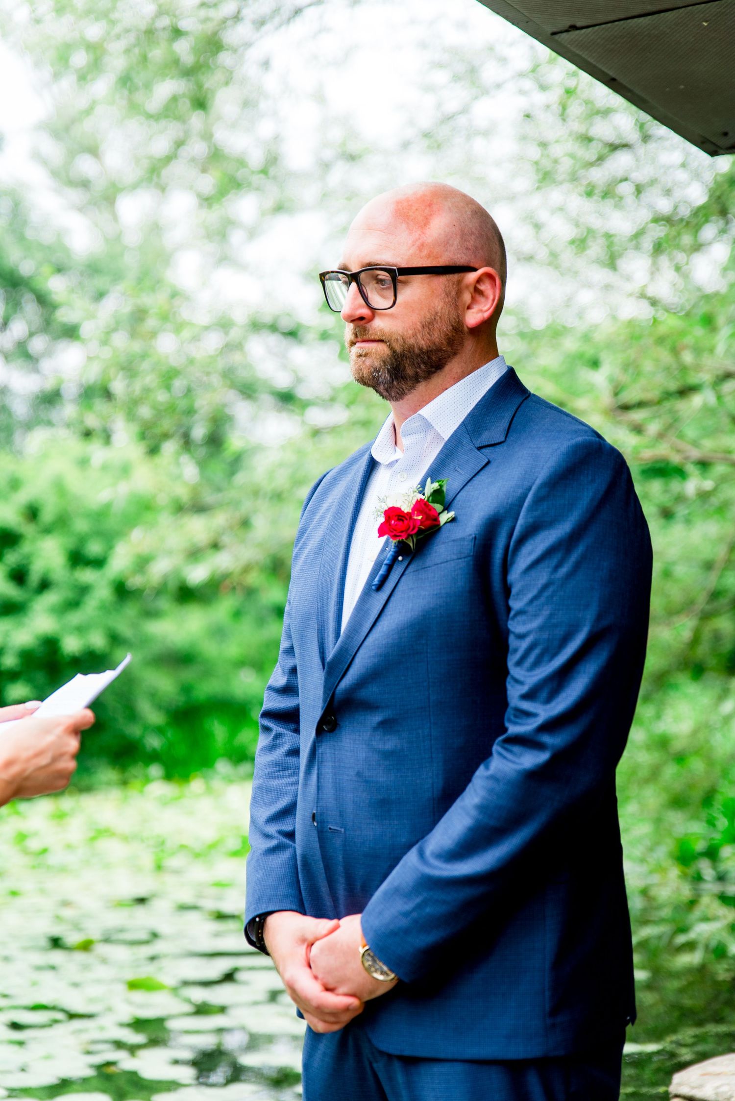 man in glasses and navy dress crying at Alfred Caldwell Lily Pool elopement vows