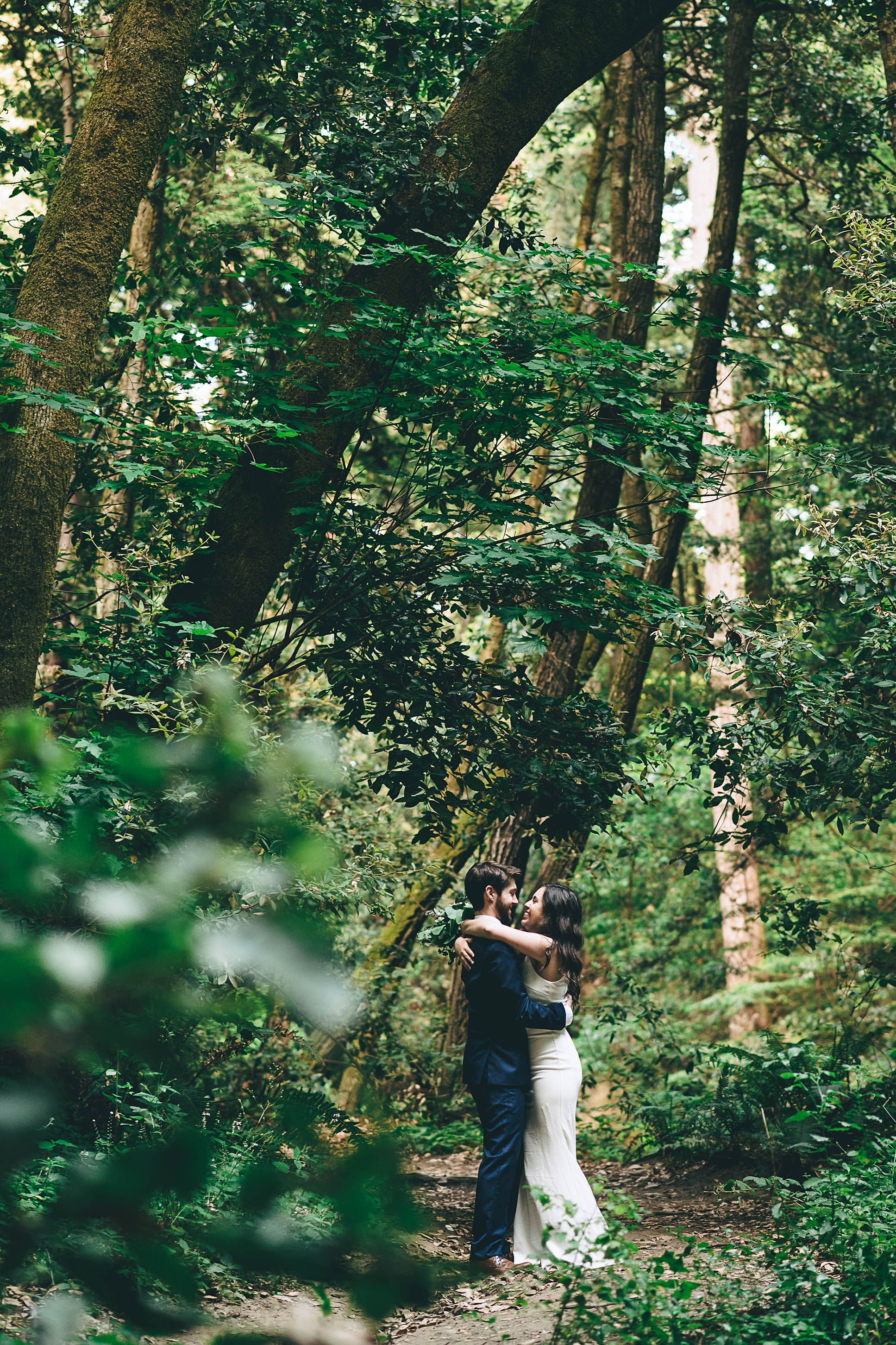 Bride and groom in the forest of Nisine Marks
