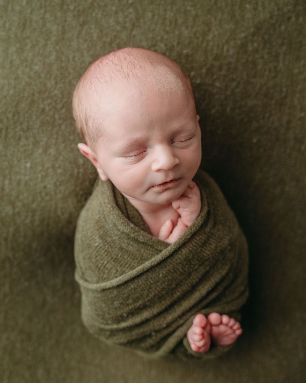 Professional newborn photo - green