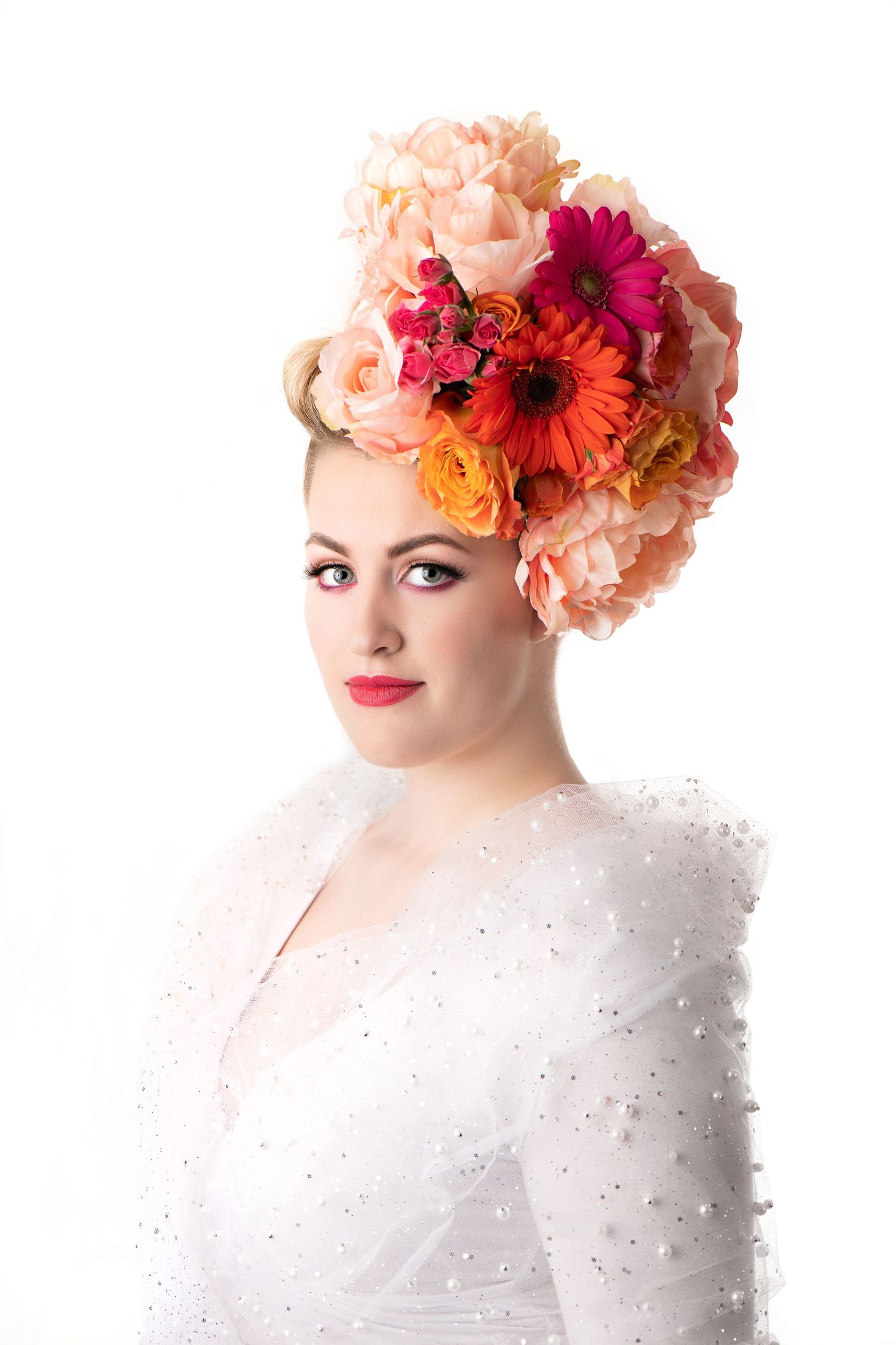 Floral head-dress, false eye lashes, pink and orange sherbet eye-shadow liquid eye-liner, watermelon lip