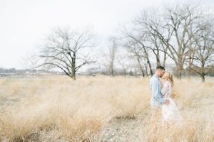 Light and airy film lakeside dock engagement session at Gray's Lake in Des Moines, Iowa