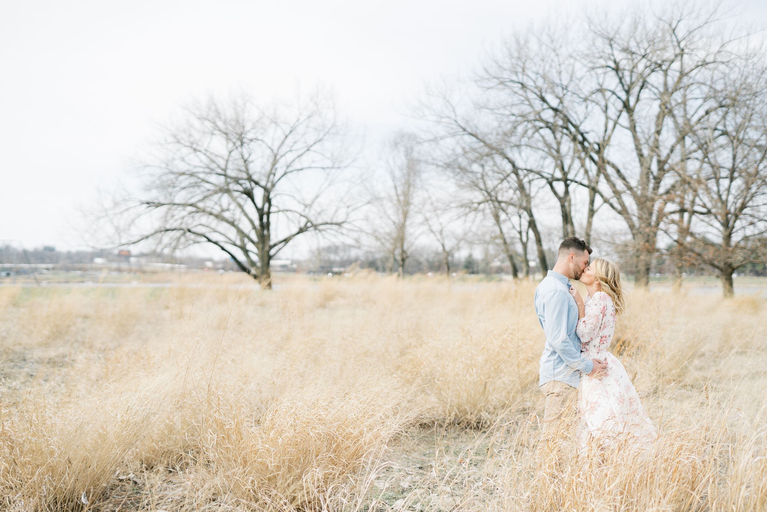 Light and airy film lakeside dock engagement session at Gray's Lake in Des Moines, Iowa