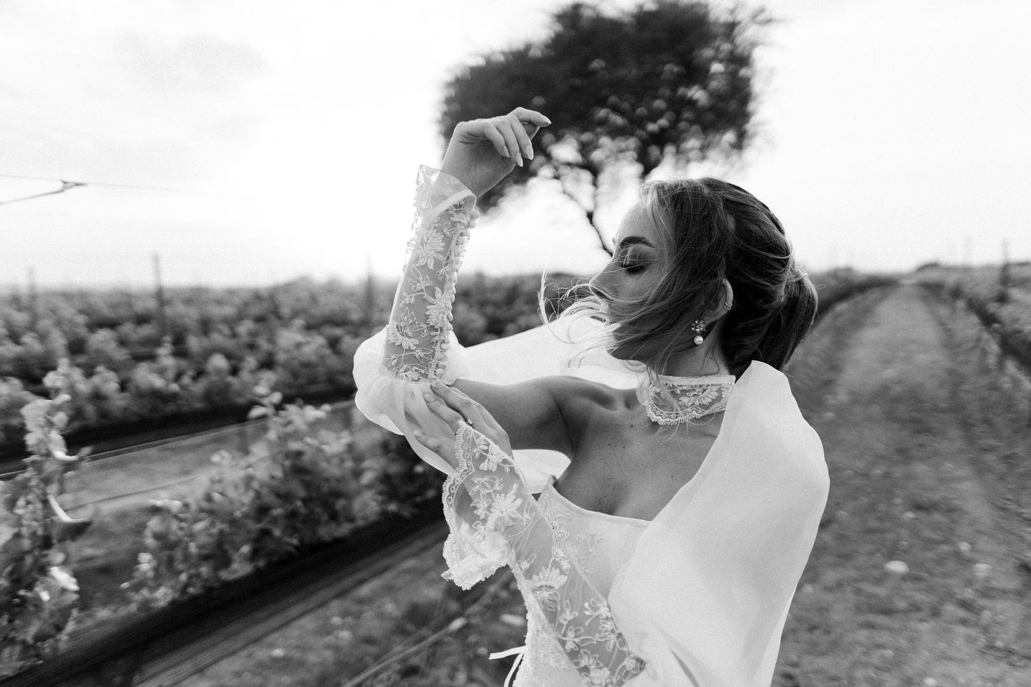 Delicate lace wedding dress details shown in a series of black and white images highlighting intricate patterns.