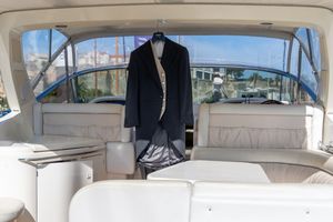 Interior view of a luxury yacht or boat cabin with beige upholstery.