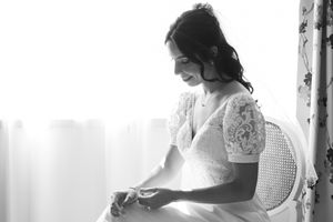 Black and white candid shots of wedding morning preparations.