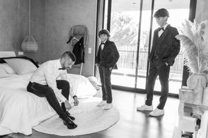 Black and white photos of wedding party members in various candid moments.