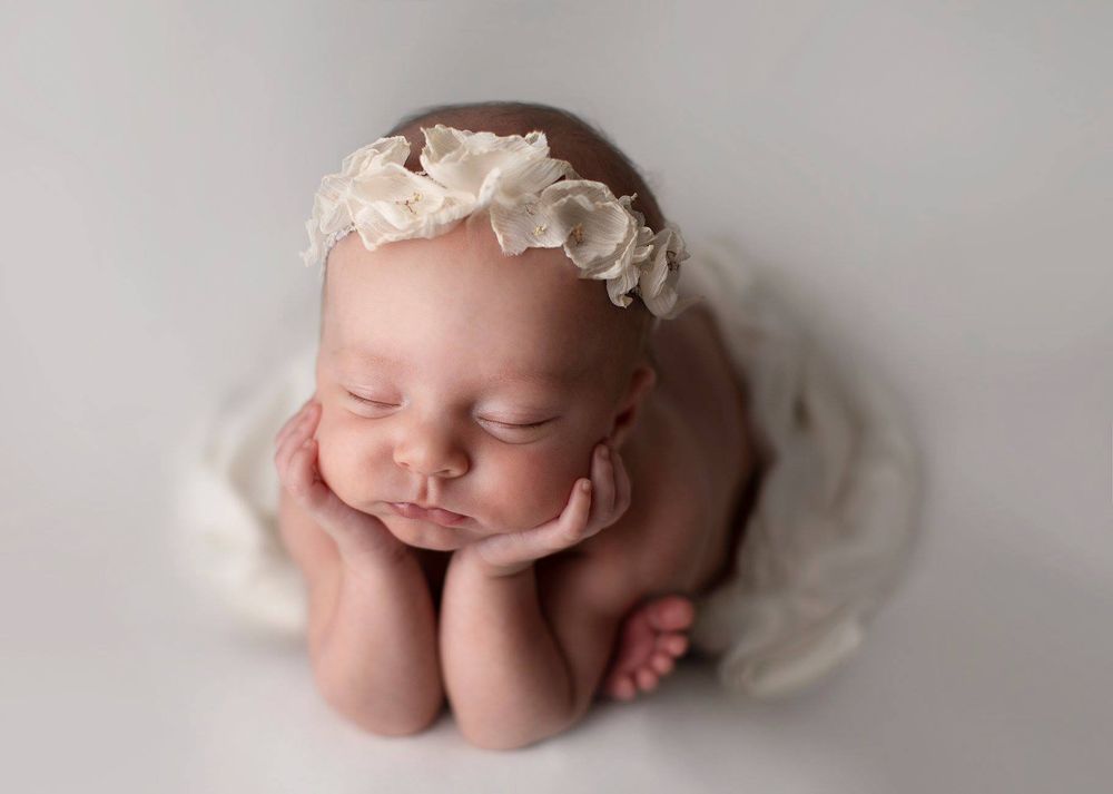 Newborn baby girl froggy pose from Elizabeth Lang Photography in Surrey.