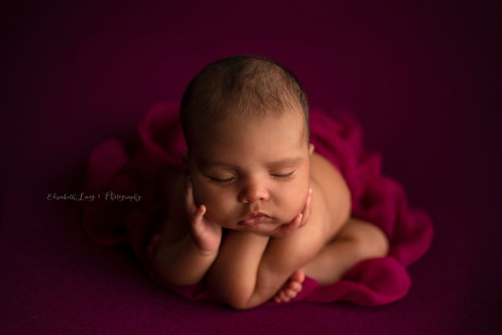Newborn baby girl froggy pose from Elizabeth Lang Photography in Surrey.